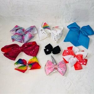 7 Cheerleader/Dance Bows Different Sizes, Colors & Holders. Missing Black Bow